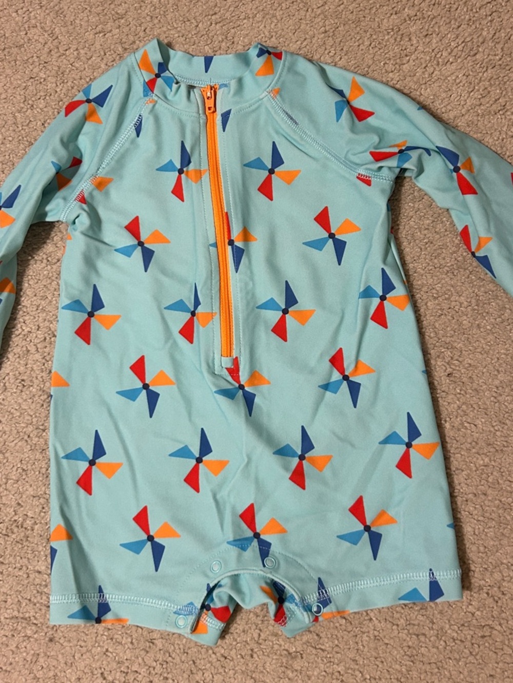 Primary Light Blue Pinwheel Zip-Up Rashguard with Orange Trim